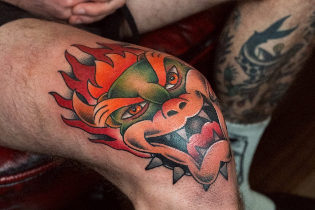 New School Bowser knee tattoo with bright gradients, recommended to place near the end of a trip due to post-tattoo leg fatigue, created at Good Times Ink Osaka.