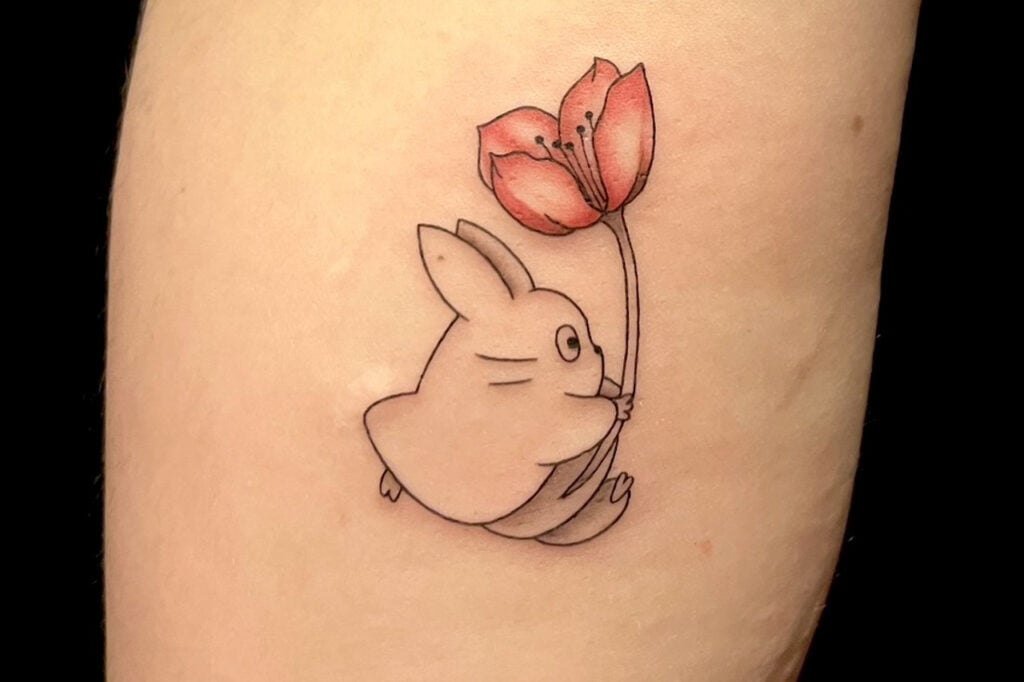 Totoro inspired tattoo showing a simple, friendly silhouette in Osaka.
