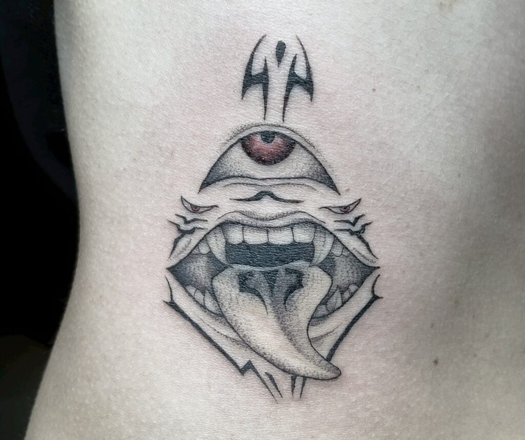 Sukuna markings‑inspired tattoo using symmetrical, ritual lines.