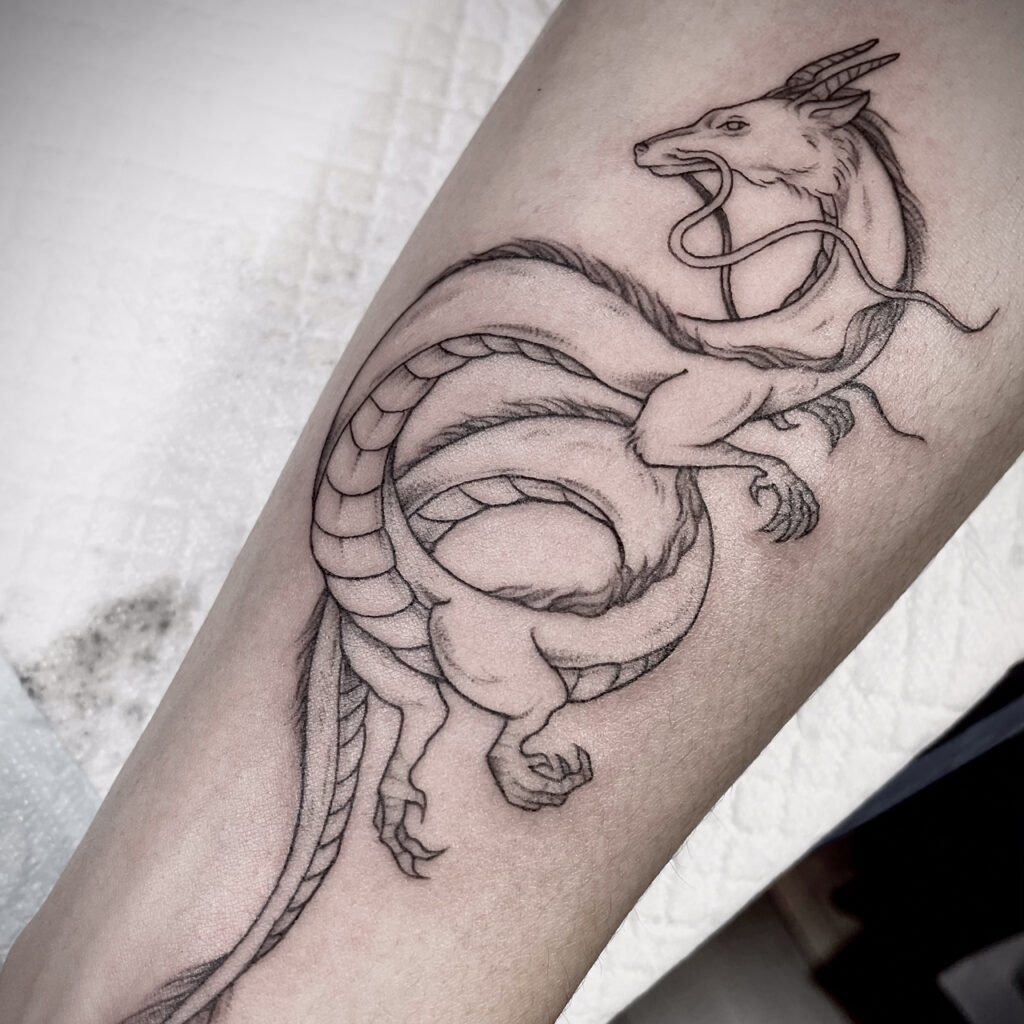 Haku river‑dragon tattoo with clear flowing body, Osaka anime studio.