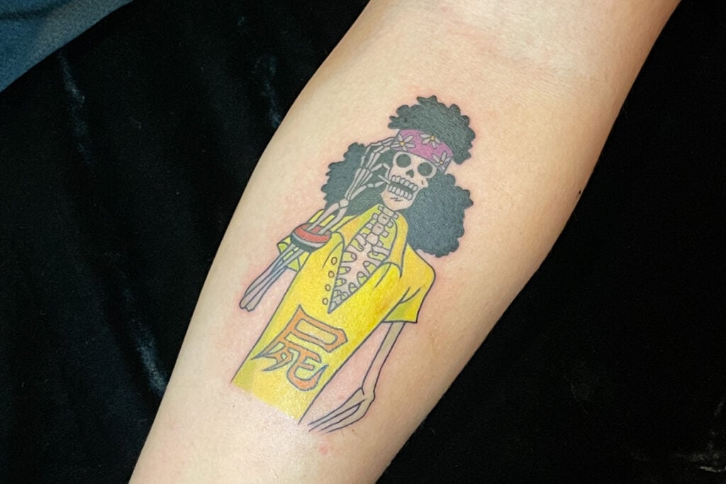 Brook gentleman‑skeleton tattoo with musical feel, Osaka studio.