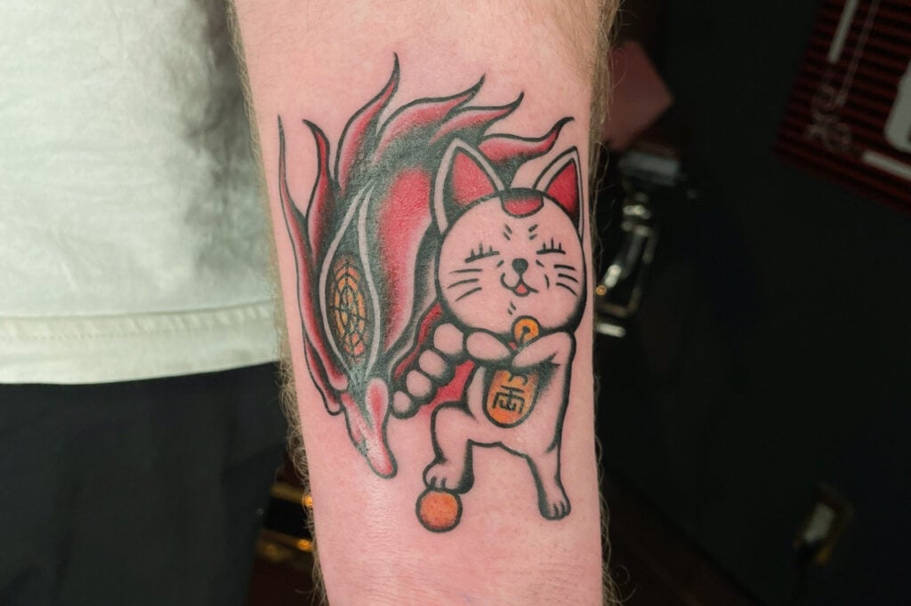 Dandadan flash tattoo design prepared for quick walk‑ins, Osaka.