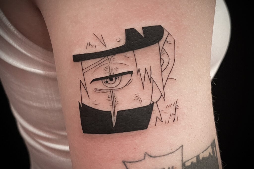 Kakashi silhouette‑driven tattoo focusing on mask and hair, Osaka.