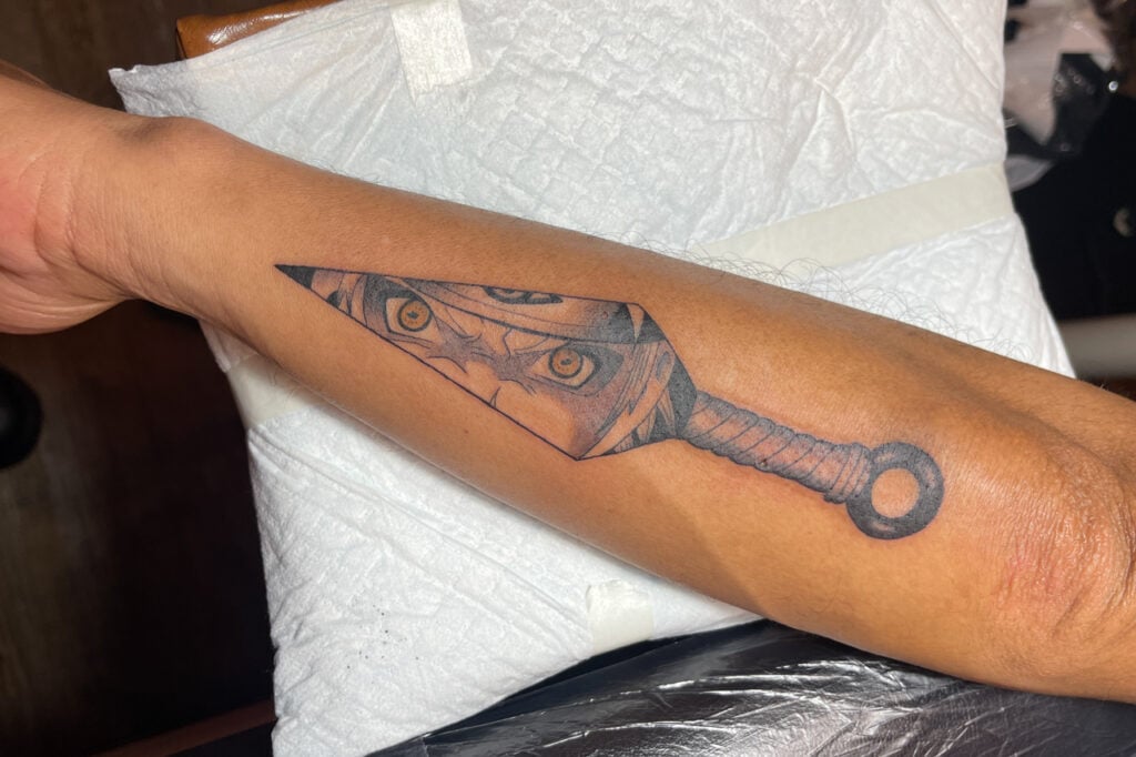 Clean kunai motif tattoo, classic ninja symbol from Osaka studio.