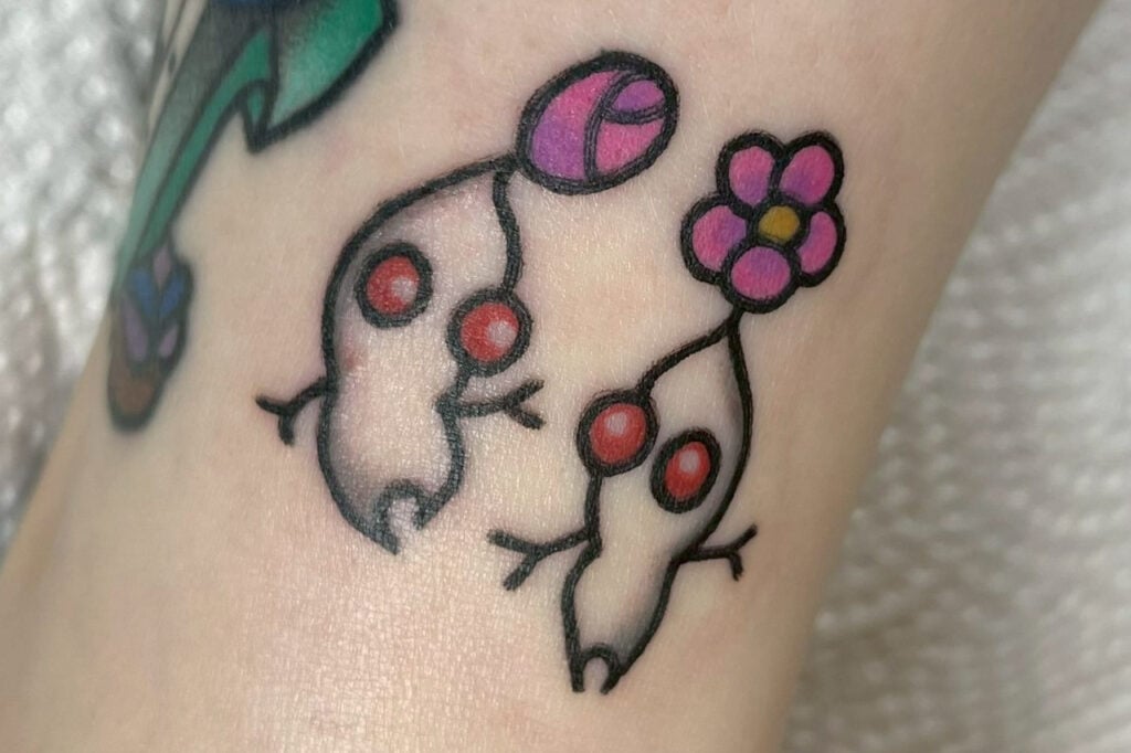 Trad-style White Pikmin tattoo redesigned by artist Horihina, created at Good Times Ink Osaka.