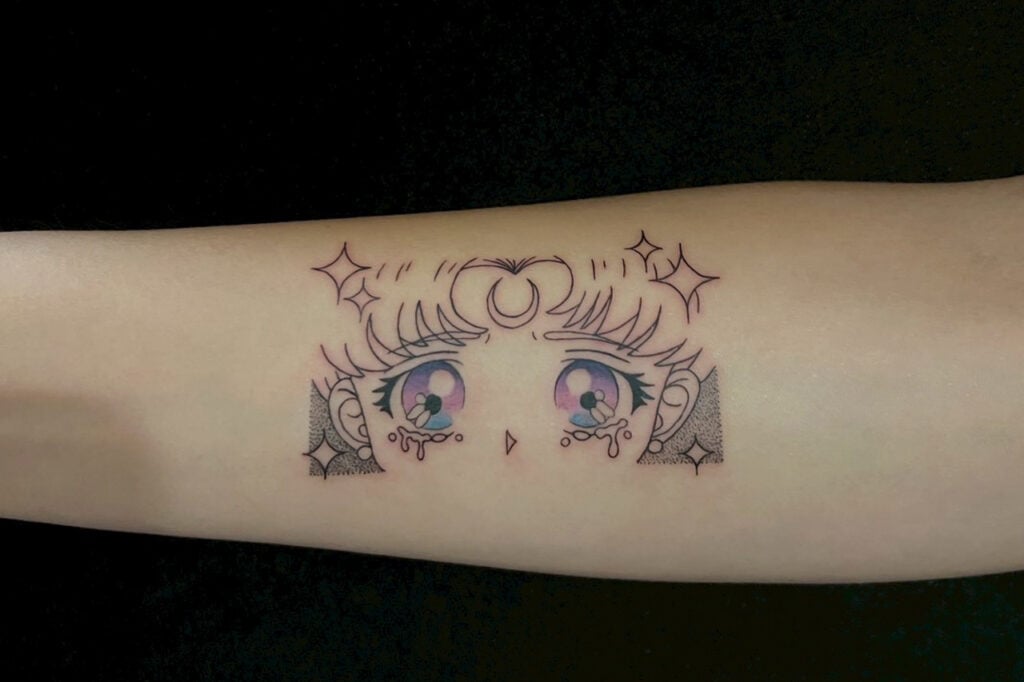 Sailor Moon crescent emblem tattoo with clean, luminous look.