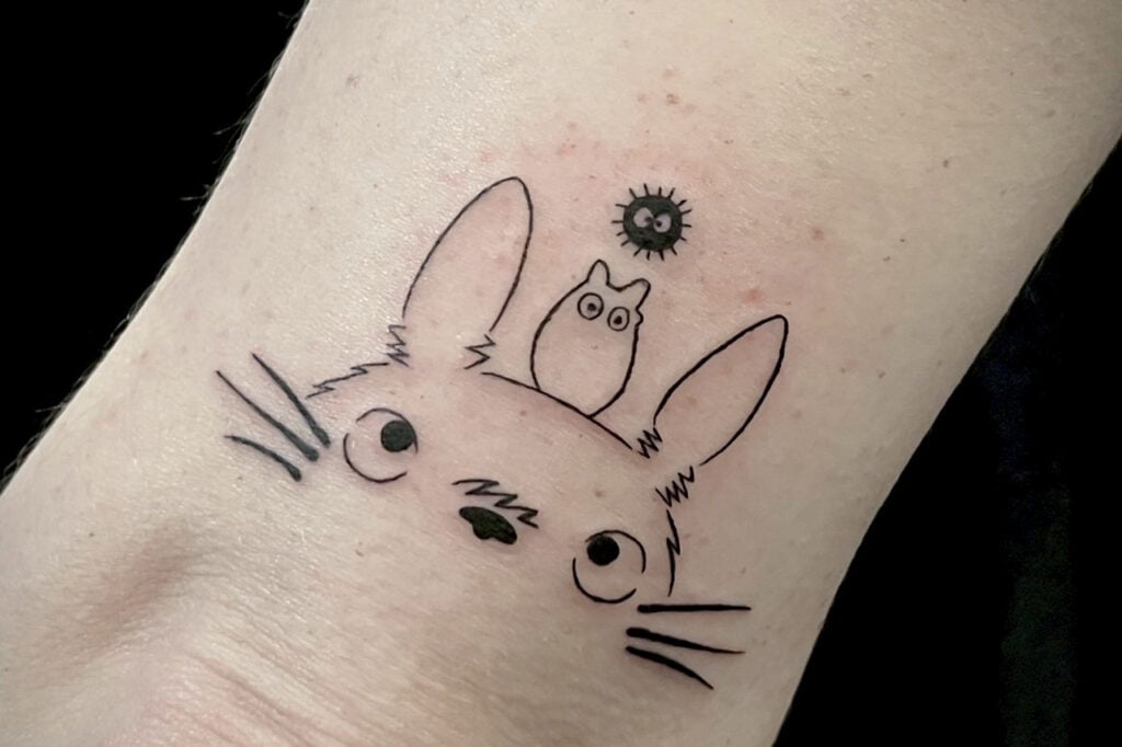 Totoro inspired tattoo showing a simple, friendly silhouette in Osaka.