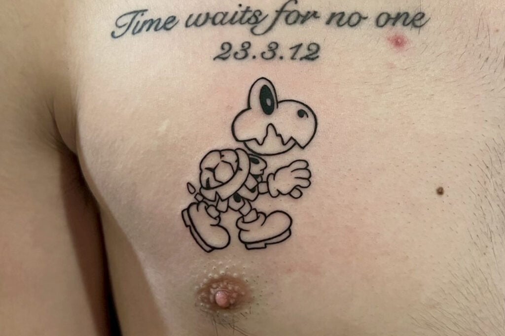 Dry Bones linework tattoo using clean outlines to express the character’s white body, created at Good Times Ink Osaka.